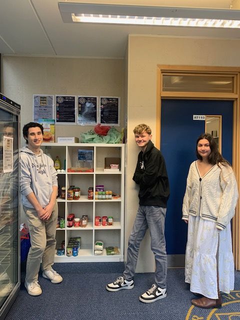 Student volunteers Marcus Arnold, Ed Addis and Anoushka Samanta pictured with the Ashurst Pantry